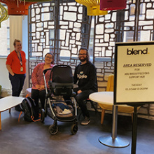 3 people gathered around a buggy